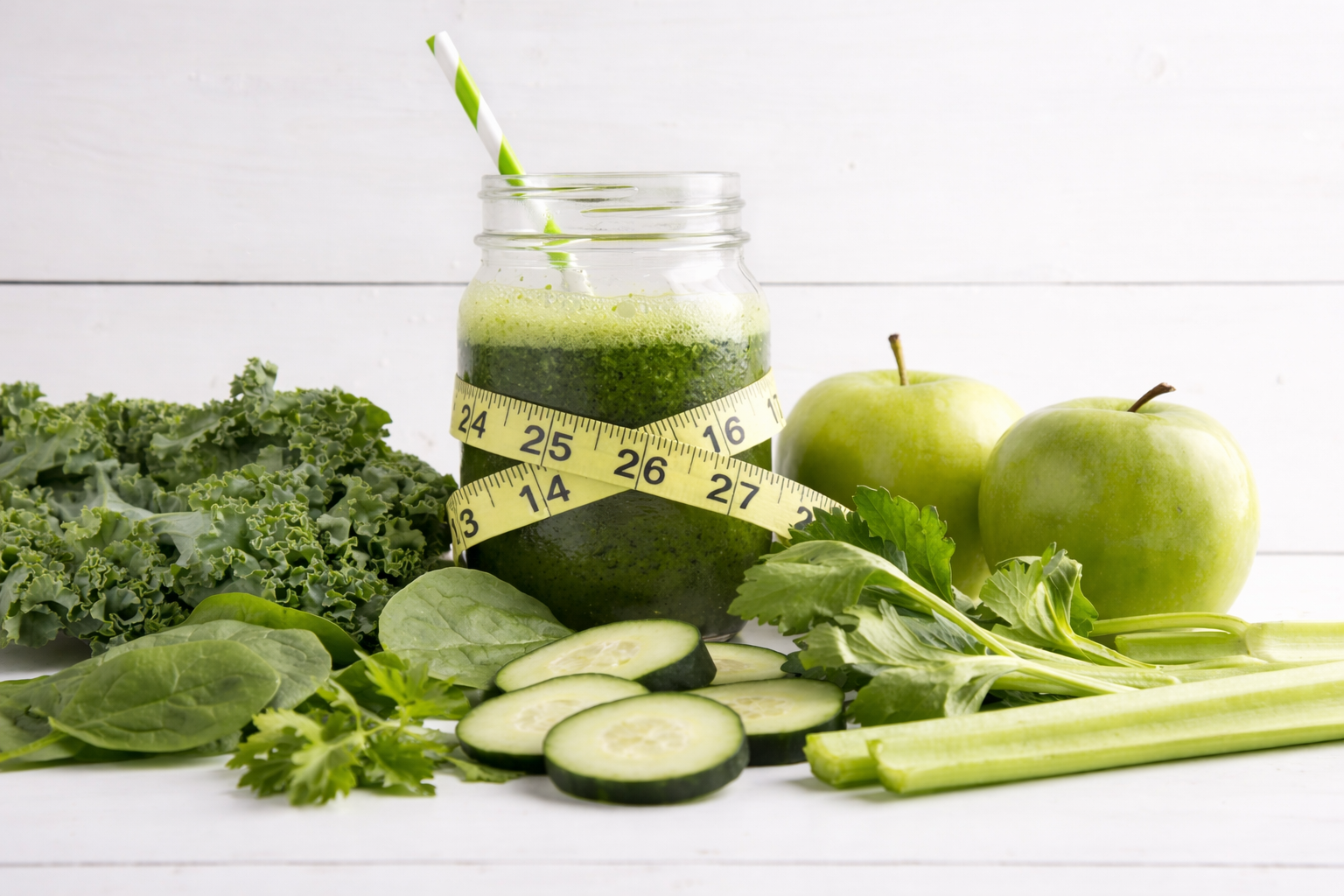 Green juice with measuring tape
